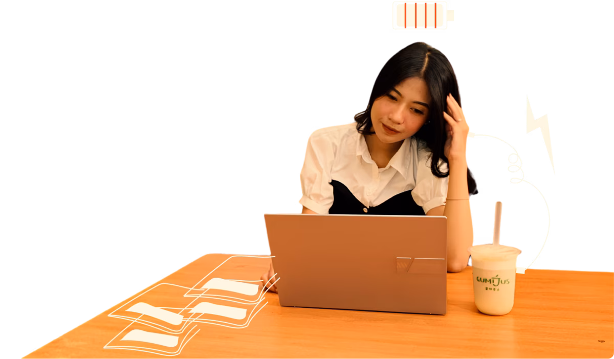 Woman working with a laptop and Gumijus drink