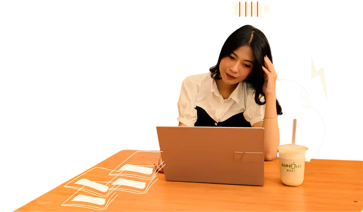 Woman working with a laptop and Gumijus drink